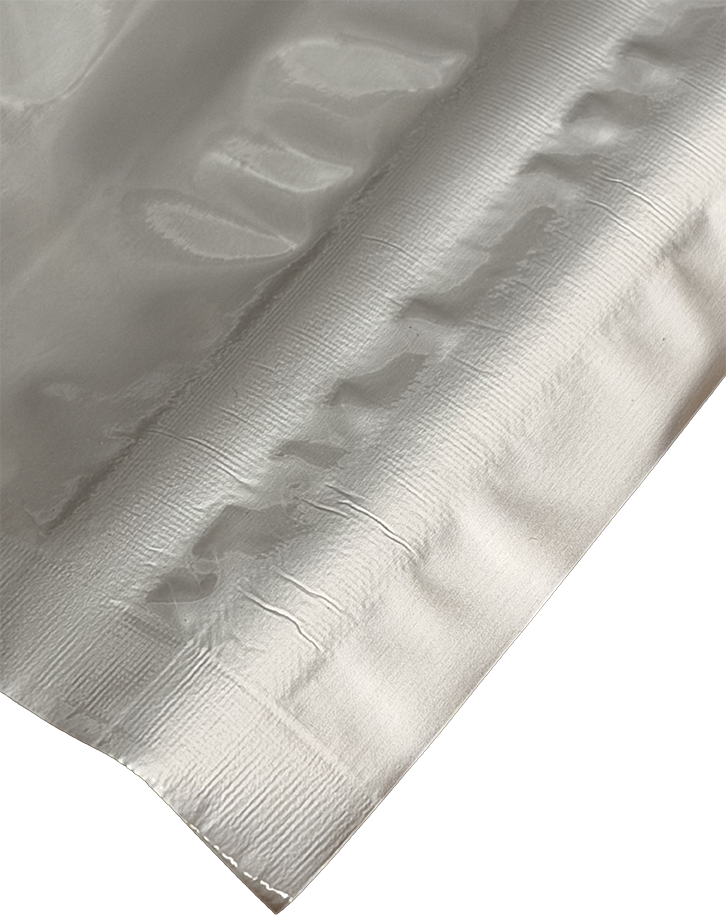 Heat sealed foil with cosmetic wrinkles